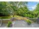 Enjoy the lovely backyard view from a deck with flower pots at 455 Firelite Ln, Suwanee, GA 30024