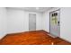 Finished basement with hardwood floors, neutral paint, and exterior door at 455 Firelite Ln, Suwanee, GA 30024
