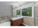 Bright bathroom featuring a vanity, window, and modern finishes at 455 Firelite Ln, Suwanee, GA 30024