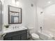 Modern bathroom with shower, bathtub and sink with large mirror at 455 Firelite Ln, Suwanee, GA 30024