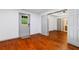 This bedroom has hardwood floors with access to a bathroom at 455 Firelite Ln, Suwanee, GA 30024