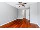Bedroom featuring hardwood floors, ceiling fan and a doorway at 455 Firelite Ln, Suwanee, GA 30024
