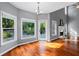 Breakfast nook filled with sunlight, access to the deck, and view to a fireplace at 455 Firelite Ln, Suwanee, GA 30024