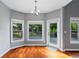 Bright breakfast nook with views of the back deck and lush greenery at 455 Firelite Ln, Suwanee, GA 30024