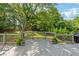 The deck has wooden railings and steps down to the backyard, providing a tranquil outdoor space at 455 Firelite Ln, Suwanee, GA 30024
