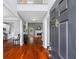 Inviting foyer with gleaming hardwood floors, high ceilings, and a view of the living spaces at 455 Firelite Ln, Suwanee, GA 30024