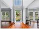 Bright foyer with hardwood floors, large windows, and a welcoming open floor plan at 455 Firelite Ln, Suwanee, GA 30024