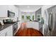 Modern kitchen featuring stainless steel appliances, granite countertops, and a bay window at 455 Firelite Ln, Suwanee, GA 30024