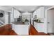 Spacious kitchen with granite countertops, stainless steel appliances, and access to the dining room at 455 Firelite Ln, Suwanee, GA 30024