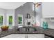 Kitchen with granite countertops, stainless steel appliances, and an open view to a fireplace at 455 Firelite Ln, Suwanee, GA 30024