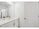 Stylish bathroom features white cabinets, granite countertops, and a modern faucet at 6555 Hawkins Manor Dr, Cumming, GA 30040