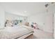 Bright bedroom boasts large window, a walk-in closet and carpet floors at 6555 Hawkins Manor Dr, Cumming, GA 30040