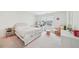 Bright bedroom boasts a window, a double bed and a rocking chair at 6555 Hawkins Manor Dr, Cumming, GA 30040