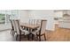 Dining room with wainscoting, hardwood floors and seating for 8 people at 6555 Hawkins Manor Dr, Cumming, GA 30040