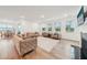 Expansive living room with hardwood floors, ample seating, fireplace, and plenty of natural light at 6555 Hawkins Manor Dr, Cumming, GA 30040