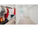 Spacious walk-in closet with organized storage, shelving and carpeted floors at 6555 Hawkins Manor Dr, Cumming, GA 30040