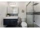 Well-lit bathroom featuring a modern vanity, mosaic tile accents, and a glass-enclosed shower at 1145 Lake Shore Overlook, Alpharetta, GA 30005