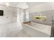Bright bathroom featuring a soaking tub, marble floors, and a glass-enclosed shower at 1145 Lake Shore Overlook, Alpharetta, GA 30005