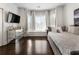Cozy bedroom with a comfortable window seat, plush bedding and warm hardwood flooring at 1145 Lake Shore Overlook, Alpharetta, GA 30005