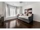 Inviting bedroom with bright natural light, plush bedding, and dark hardwood flooring at 1145 Lake Shore Overlook, Alpharetta, GA 30005