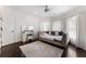 Cozy bedroom with a daybed, vanity, and hardwood floors, perfect for relaxation at 1145 Lake Shore Overlook, Alpharetta, GA 30005