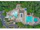 Aerial shot of a large community pool area with multiple pools, a water slide, lounge chairs, and a snack bar at 1145 Lake Shore Overlook, Alpharetta, GA 30005
