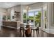 Bright kitchen and breakfast nook with large windows, modern appliances, and stylish dining area at 1145 Lake Shore Overlook, Alpharetta, GA 30005