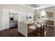 Stylish kitchen features sleek white cabinets, stainless steel appliances, and a spacious island with bar seating at 1145 Lake Shore Overlook, Alpharetta, GA 30005