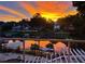 Enjoy breathtaking sunset views over the tranquil lake from this beautiful property with outdoor lounge area at 1145 Lake Shore Overlook, Alpharetta, GA 30005