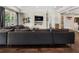 Spacious living room has a large comfortable couch, fireplace, and access to the bathroom at 1145 Lake Shore Overlook, Alpharetta, GA 30005