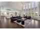 Bright and airy living room with high ceilings, large windows, and open concept design, ideal for modern living at 1145 Lake Shore Overlook, Alpharetta, GA 30005