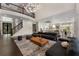 Spacious living room with high ceilings, a modern chandelier, and an open layout, perfect for entertaining and relaxation at 1145 Lake Shore Overlook, Alpharetta, GA 30005