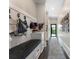 Well-organized mud room with bench, storage, and coat hooks for a clutter-free home entry at 1145 Lake Shore Overlook, Alpharetta, GA 30005