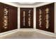 Modern wine room featuring custom shelving and lighting for displaying wine collections at 1145 Lake Shore Overlook, Alpharetta, GA 30005