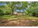 Spacious backyard with mature trees and two-story house at 218 Deerwood Se Ct, Smyrna, GA 30082