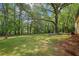 Lush backyard with mature trees at 218 Deerwood Se Ct, Smyrna, GA 30082