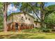 Two-story house surrounded by lush greenery and mature trees at 218 Deerwood Se Ct, Smyrna, GA 30082