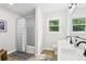 Bright bathroom featuring a shower-tub combo and a modern vanity with matte black fixtures at 218 Deerwood Se Ct, Smyrna, GA 30082