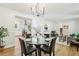Open-concept dining room with a glass table, connecting to the kitchen and living areas at 218 Deerwood Se Ct, Smyrna, GA 30082