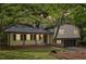 Charming home featuring a covered front porch, manicured lawn and attached garage at 218 Deerwood Se Ct, Smyrna, GA 30082