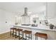 Kitchen island features bar seating with modern appliances, sink, and cabinets at 218 Deerwood Se Ct, Smyrna, GA 30082