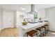 Contemporary kitchen featuring an island with seating, white cabinets and modern fixtures at 218 Deerwood Se Ct, Smyrna, GA 30082
