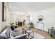 Inviting living room with modern decor, featuring a gray sofa and dining area at 218 Deerwood Se Ct, Smyrna, GA 30082