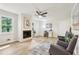 Cozy living room featuring a fireplace, lots of natural light and hardwood flooring at 218 Deerwood Se Ct, Smyrna, GA 30082