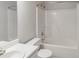 Bright bathroom featuring a shower-tub combo with a clean white surround and a coordinated vanity at 2320 Crystal Ct, Loganville, GA 30052