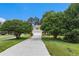 Quaint two-story home with a long driveway and lots of mature trees at 2320 Crystal Ct, Loganville, GA 30052