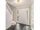 Foyer features tile floor, staircase and sidelight windows at 2320 Crystal Ct, Loganville, GA 30052