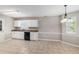 Open kitchen area featuring stainless sink, dishwasher, and an abundance of lighting at 2320 Crystal Ct, Loganville, GA 30052