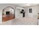 Open kitchen with tile floor, granite counters and stainless steel appliances at 2320 Crystal Ct, Loganville, GA 30052