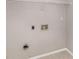 Functional laundry area with washer and dryer hookups and tile flooring at 2320 Crystal Ct, Loganville, GA 30052